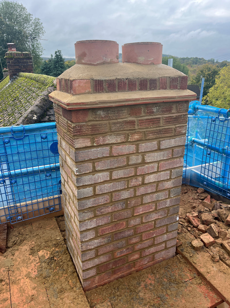 Structural shell of a residential extension featuring professional breeze block masonry, clean mortar joints, and a level concrete base.